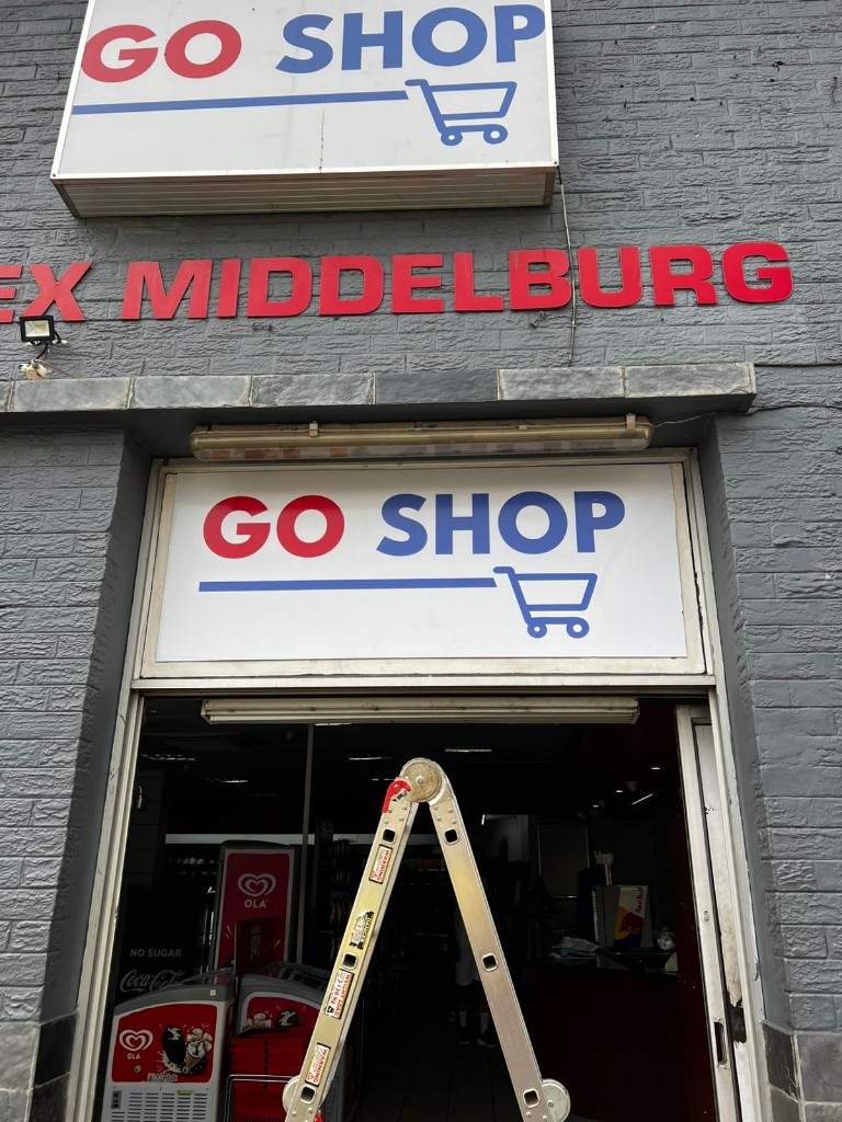 GO SHOP illuminated lightbox and EX MIDDELBURG 3D letters by Plan Photo Repro